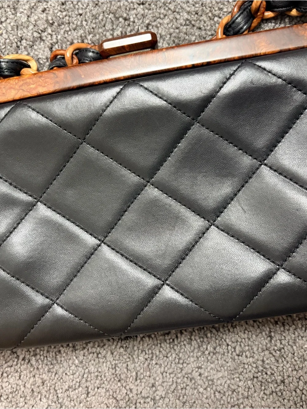 CHANEL Black Quilted Leather Shoulder Bag with Brown Chain